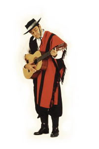 Man Wearing Traditional Clothing Playing Guitar