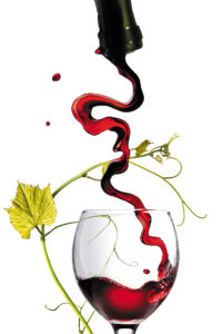 Pouring red wine in glass with rod isolated on white